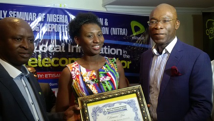 (L-r): Emma Okonji, president of NITRA, Chineze Amanfo, Public Relations Manager,‎ observes as Leo-Stan Ekeh, chairman of Zinox Group receives a gift from NITRA.